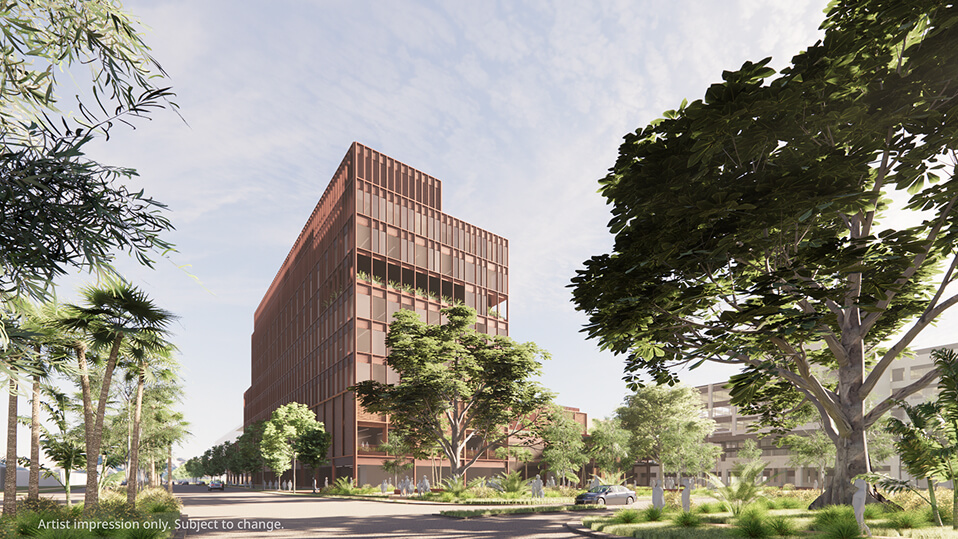 A new multi-storey Redcliffe Hospital building shown from the street, surrounded by large trees and landscaping.